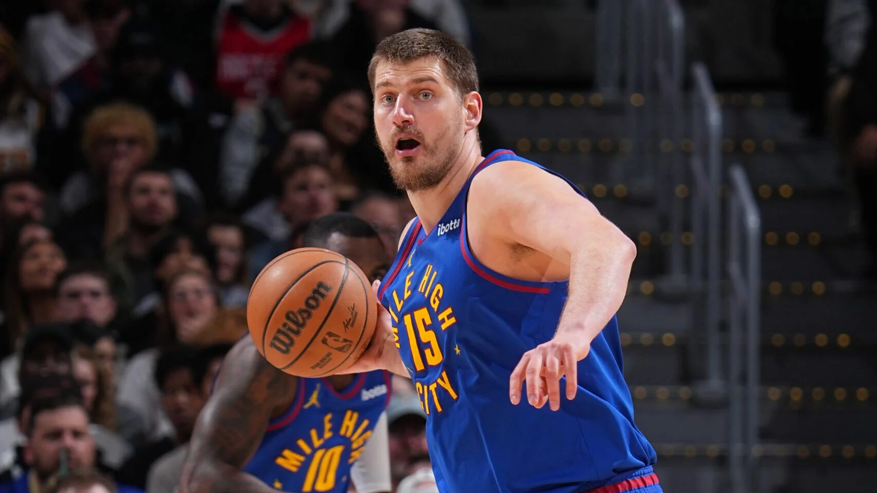 Nikola Jokic handles the basketball during a Denver Nuggets game against the Indiana Pacers