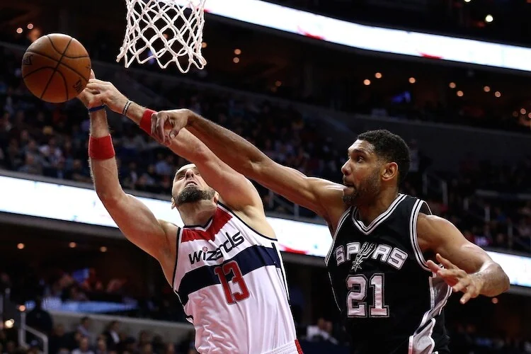 Tim Duncan defending for the San Antonio Spurs during an NBA game