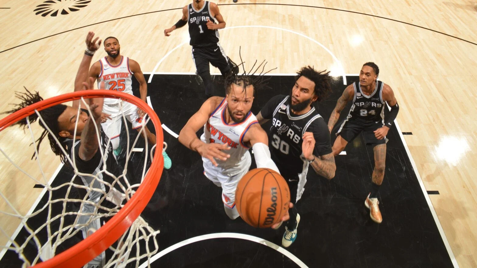 An Eastern Conference team and Western Conference team competing in an NBA regular-season game