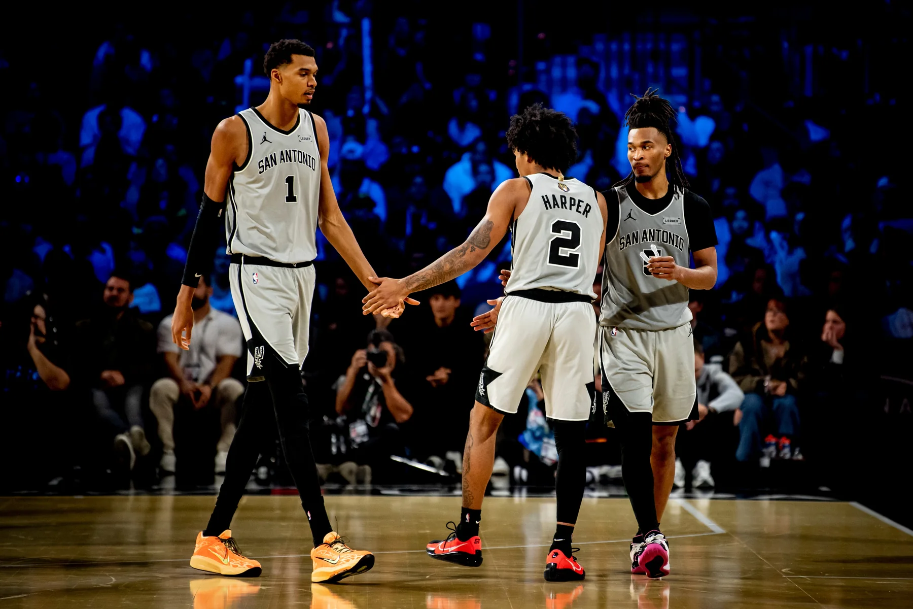 Victor Wembanyama, Dylan Harper and Stephon Castle on court during the 2025 NBA Cup championship