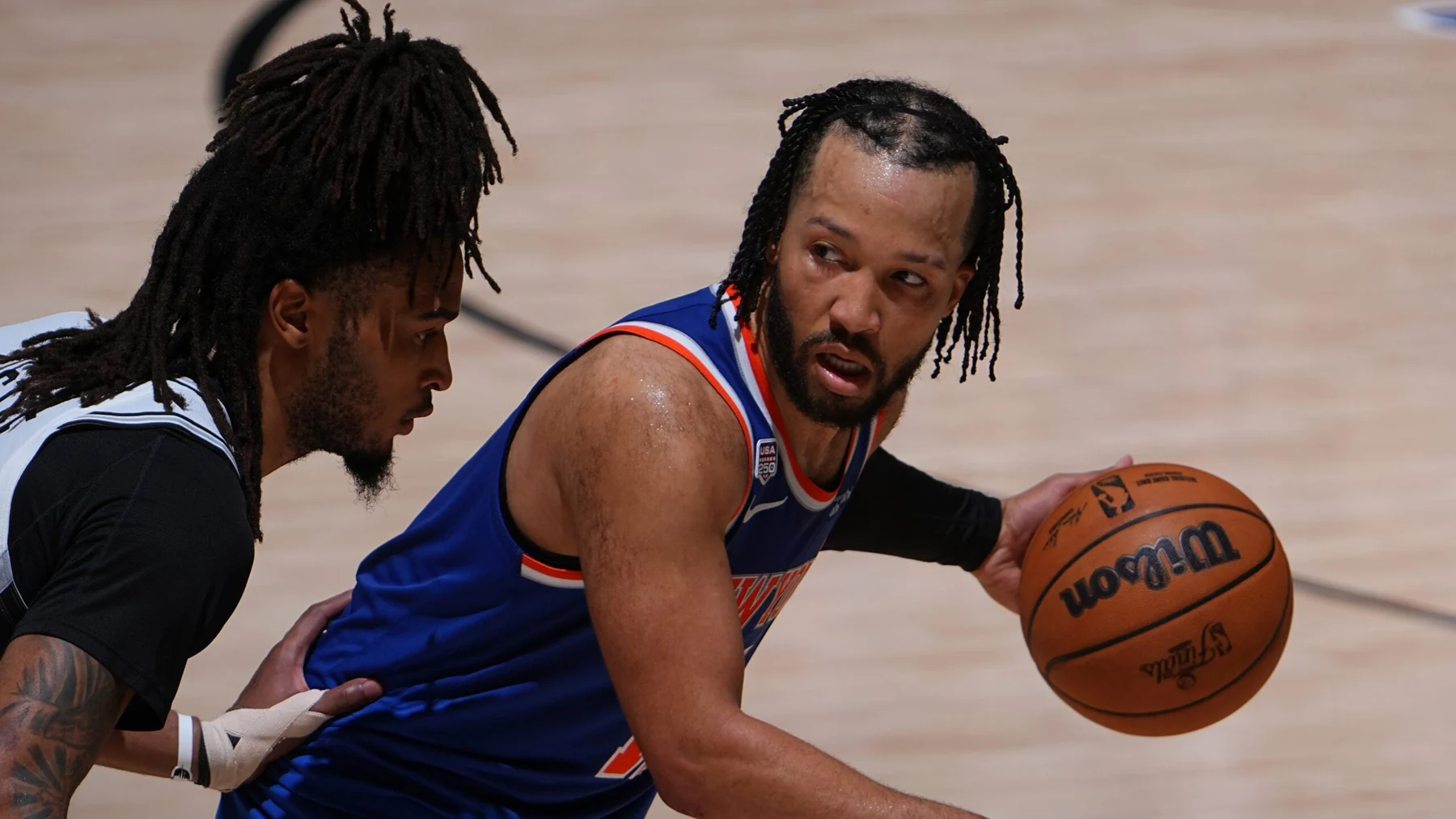 Jalen Brunson attacking the San Antonio Spurs defense during the 2026 NBA Finals