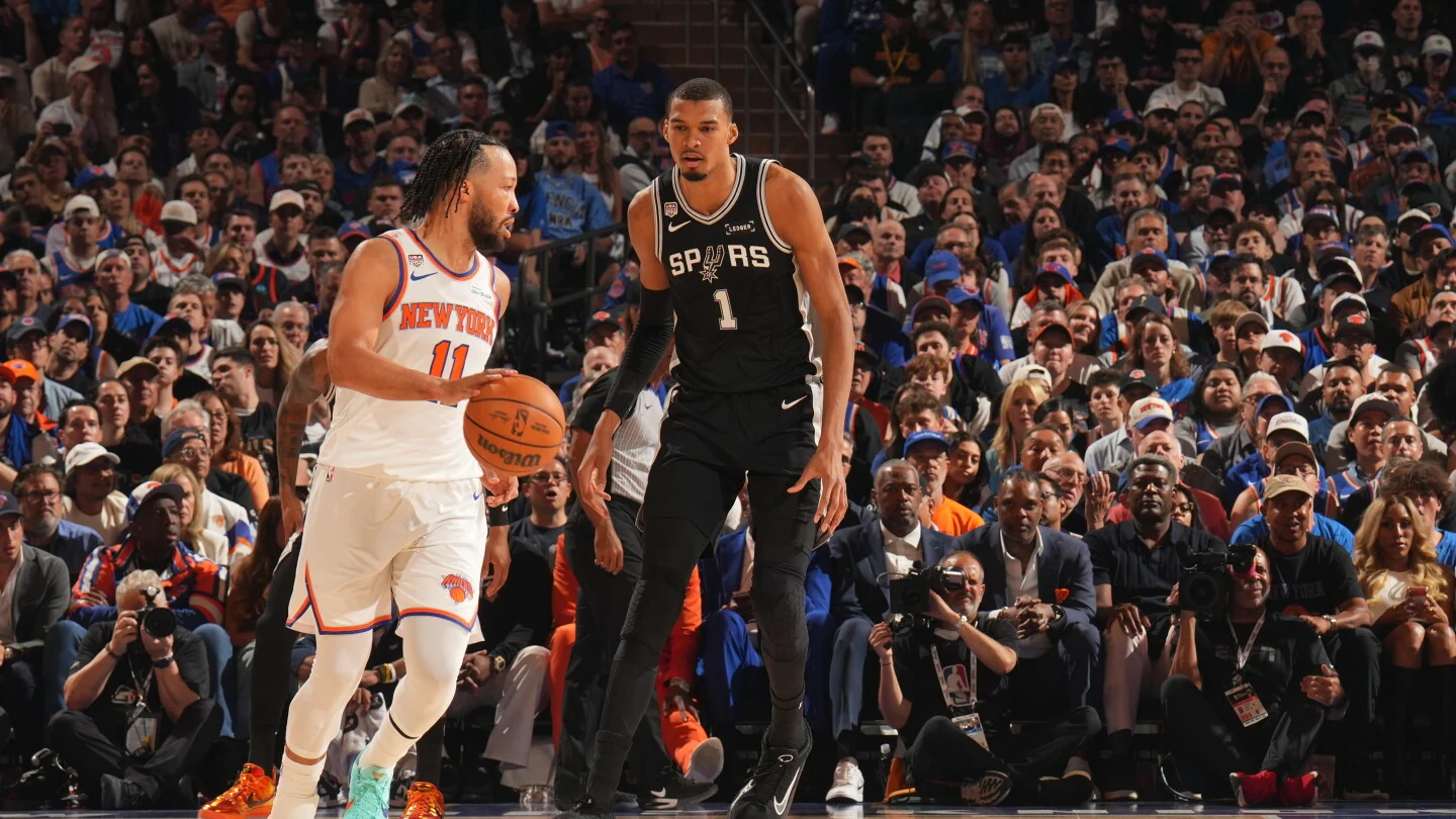 NBA ballhandler driving into contact during a 2026 playoff game