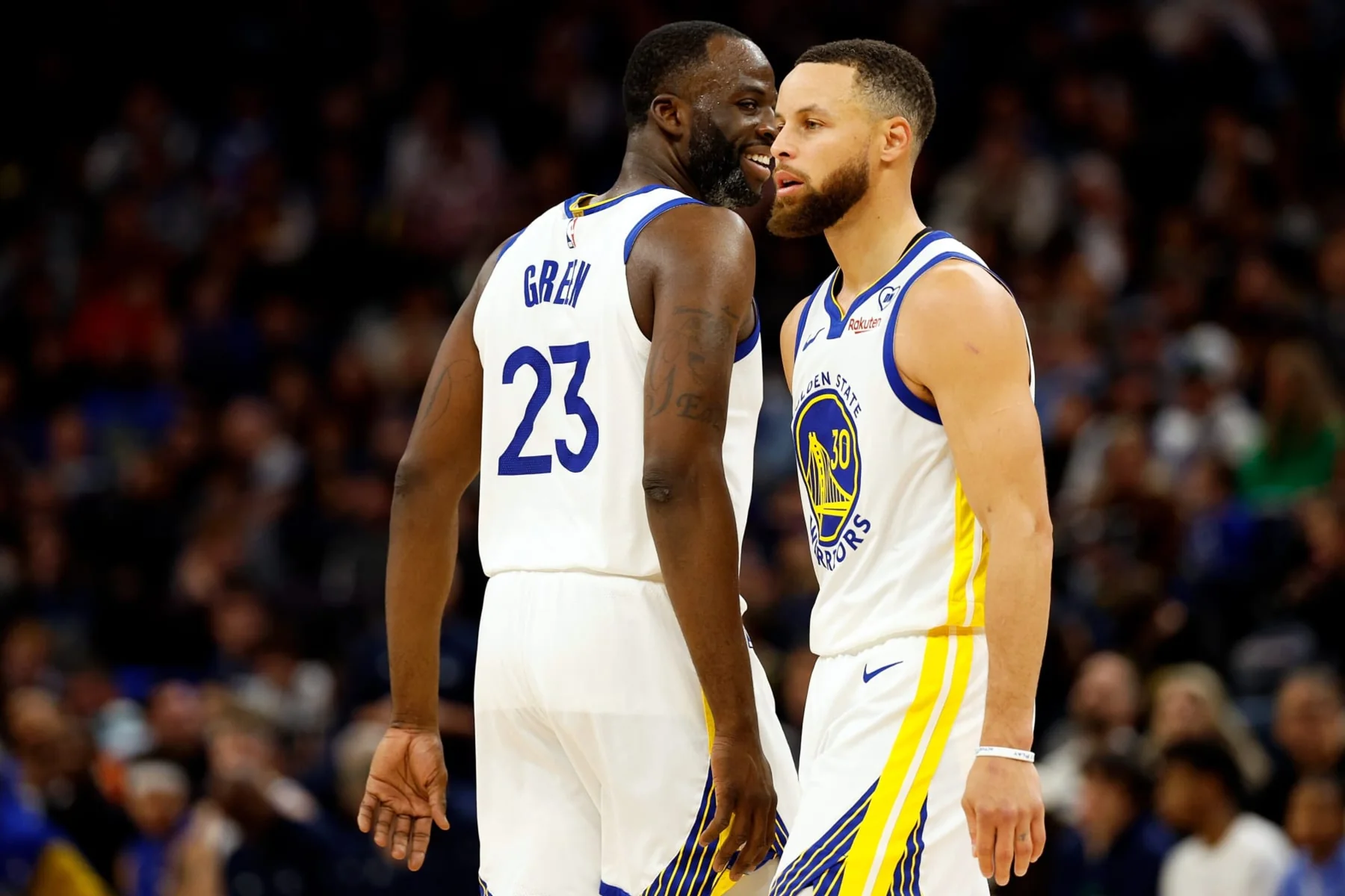 Stephen Curry and Draymond Green communicating during a Golden State Warriors game